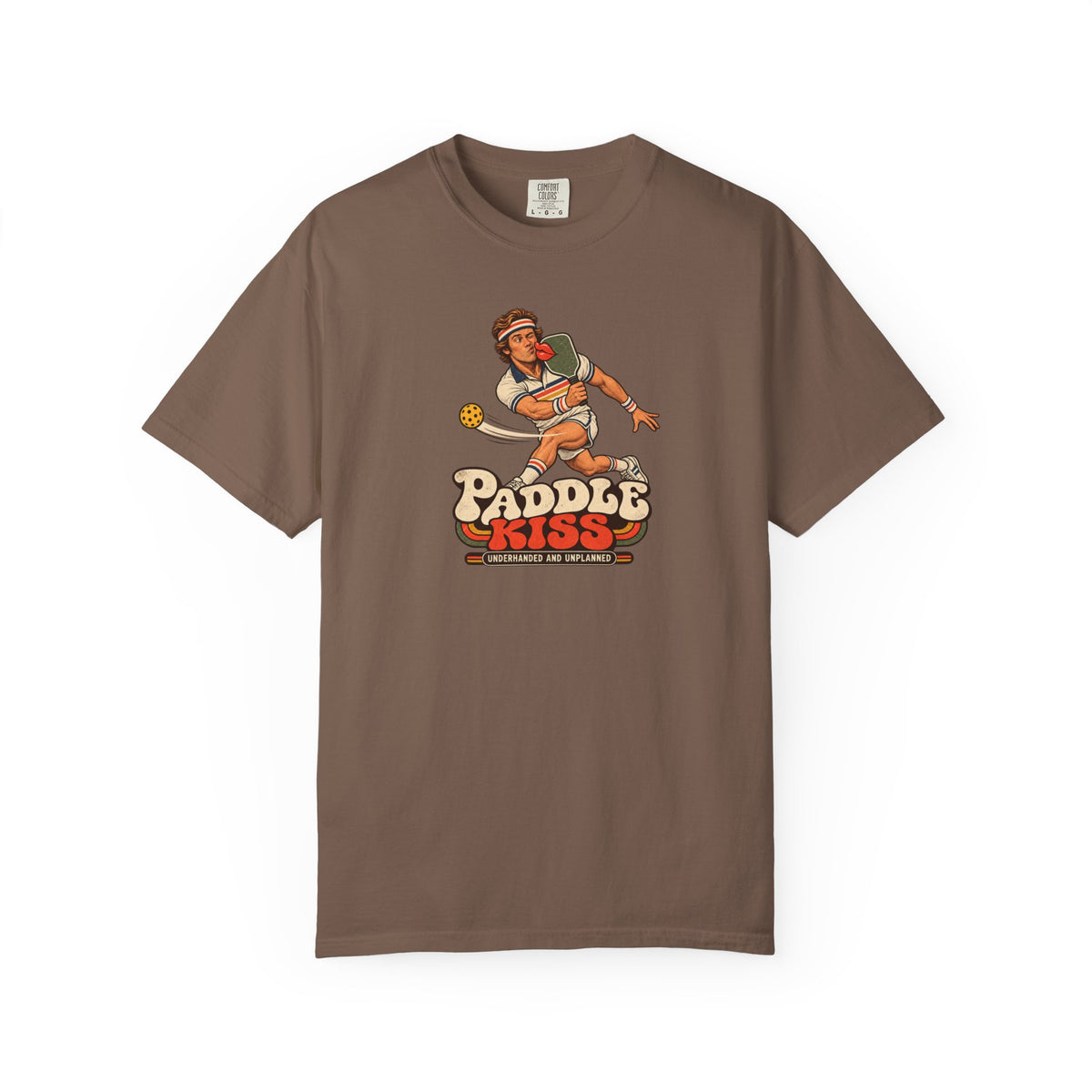 Espresso colored Paddle Kiss pickleball t-shirt with playful vintage paddle-and-pickleball character graphic.