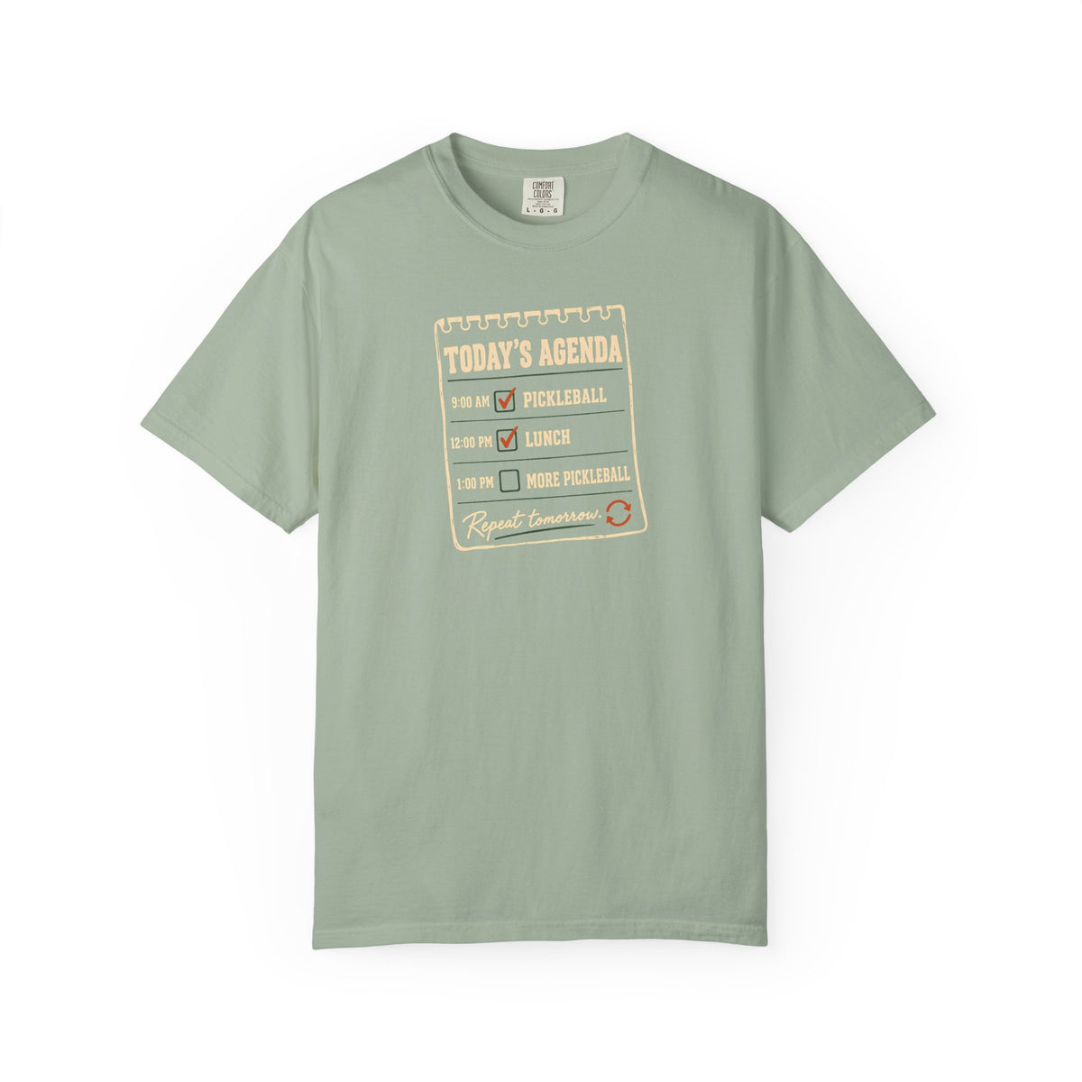 Sage colored Today's Agenda pickleball t-shirt with framed checklist-style pickleball graphic and vintage typography.