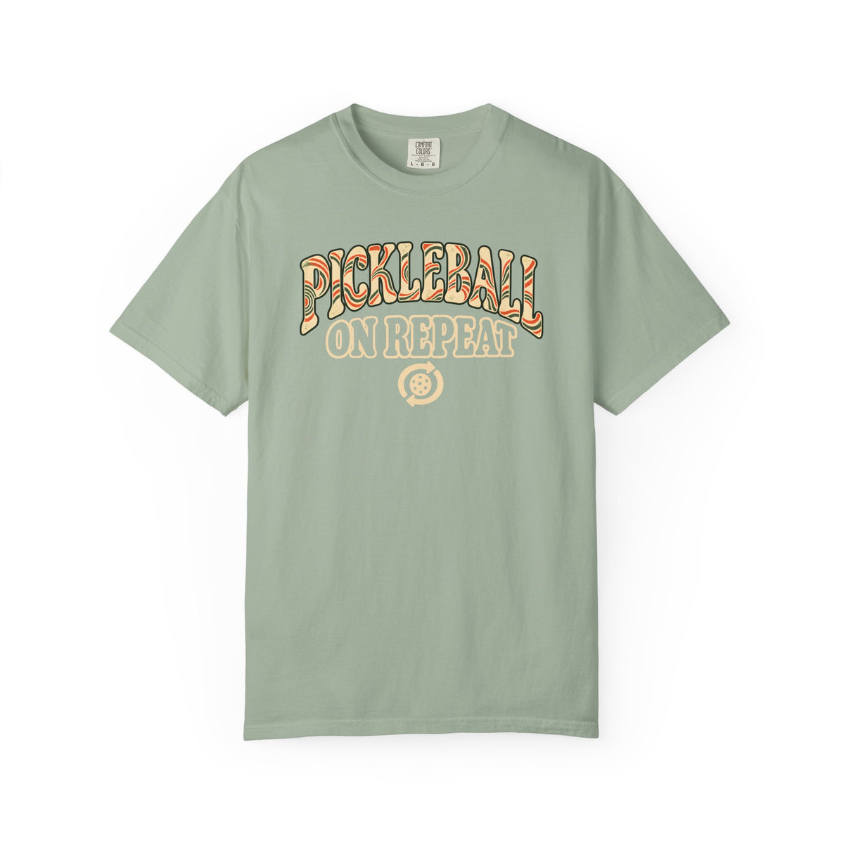 Sage colored Pickleball On Repeat pickleball t-shirt with warm retro varsity-style typography.