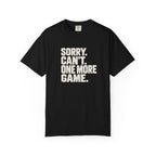Black colored Sorry. Can't. One More Game. pickleball t-shirt with bold stacked cream typography.