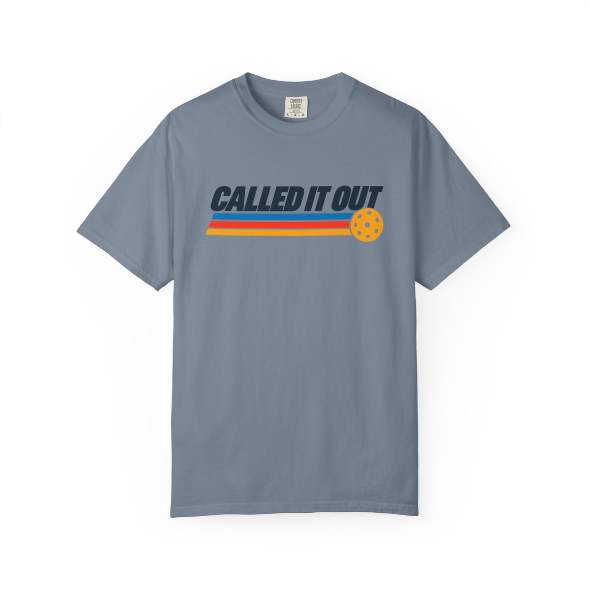 Blue-gray colored Called It Out pickleball t-shirt with bold retro lettering and yellow pickleball accent.