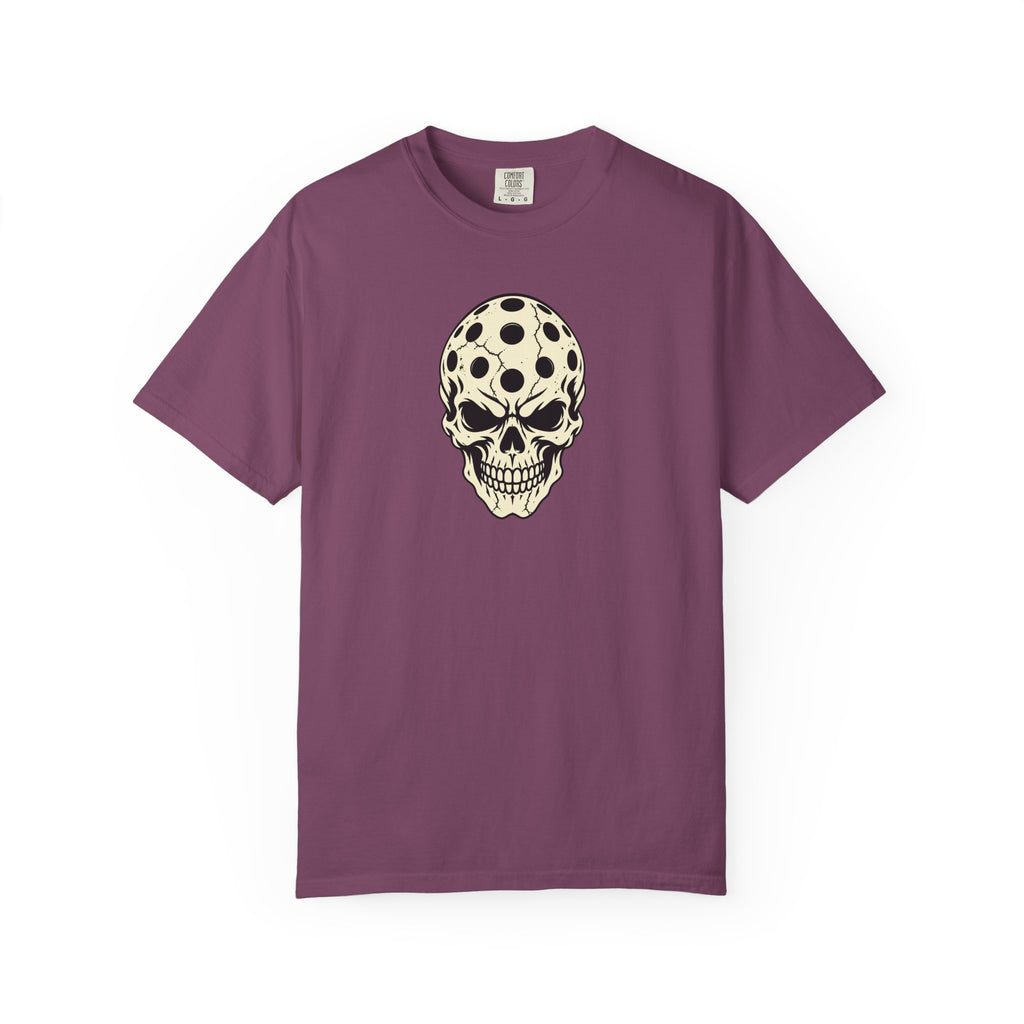 Berry colored Pickleball Skull t-shirt with skull illustration featuring perforated pickleball details.