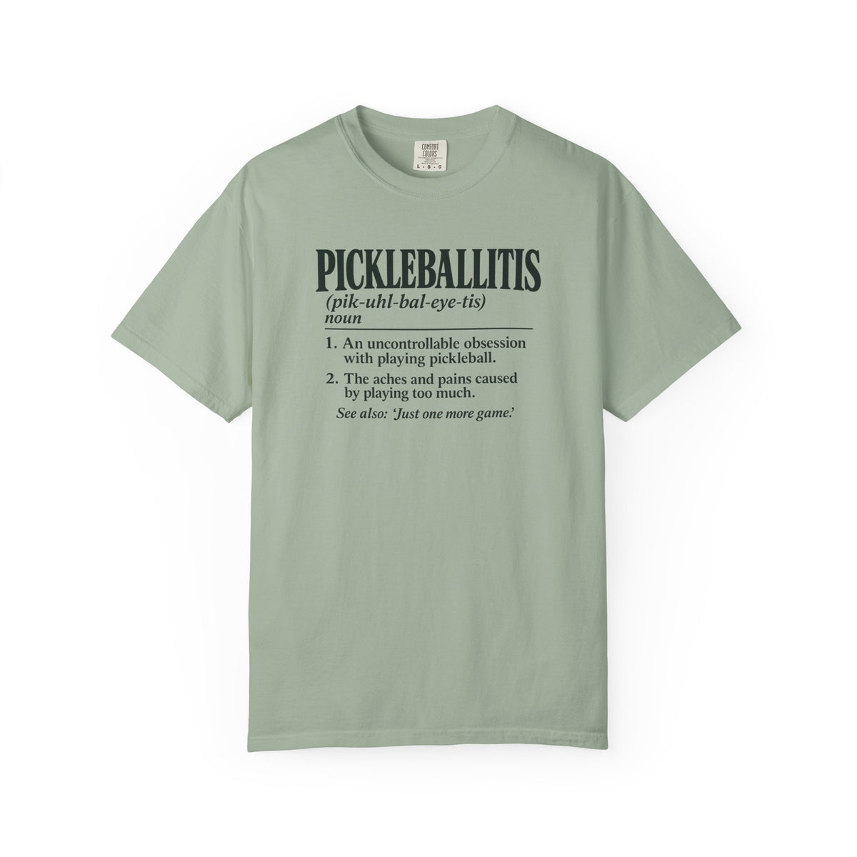 Sage colored Pickleballitis pickleball t-shirt with dictionary-style diagnosis typography and humorous definition.
