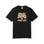 Black colored Play More Adult Less pickleball t-shirt with playful cream script typography.