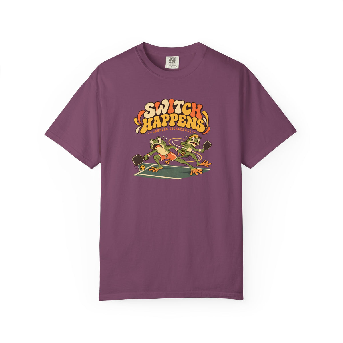 Berry colored Switch Happens pickleball t-shirt with colorful retro court graphic and bold curved lettering.