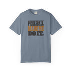 Blue-gray colored Pickleball Made Me Do It t-shirt with bold distressed retro pickleball typography.