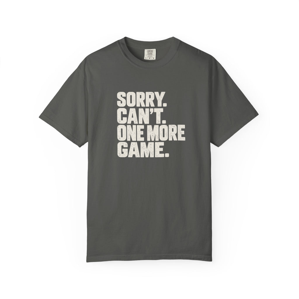 Pepper colored Sorry. Can't. One More Game. pickleball t-shirt with bold stacked cream typography.
