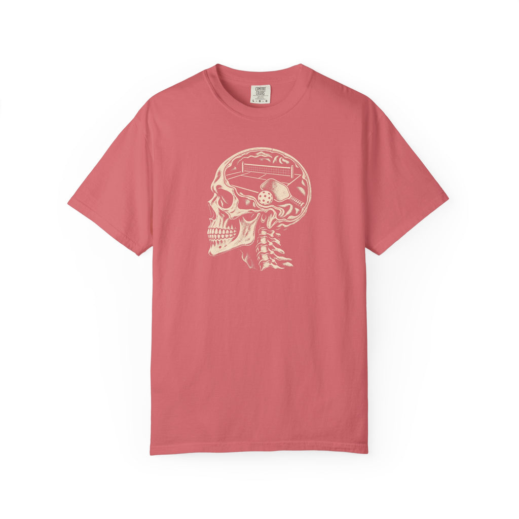 Watermelon colored Pickleball On The Brain t-shirt with skull illustration and pickleball-themed head graphic.