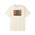 Ivory colored Dink. Repeat. pickleball t-shirt with orange-and-black retro badge-style typography.