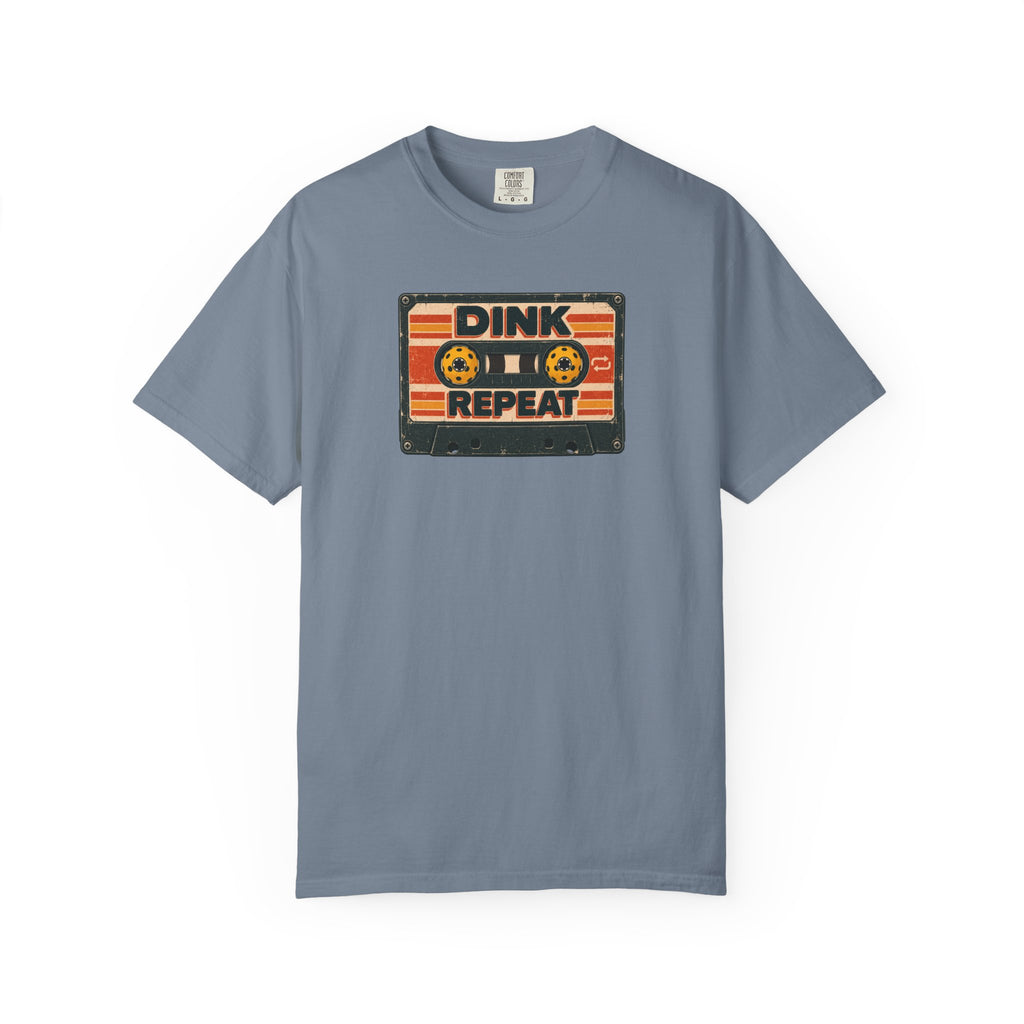Blue-gray colored Dink. Repeat. pickleball t-shirt with orange-and-black retro badge-style typography.