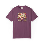 Berry colored Play More Adult Less pickleball t-shirt with playful cream script typography.