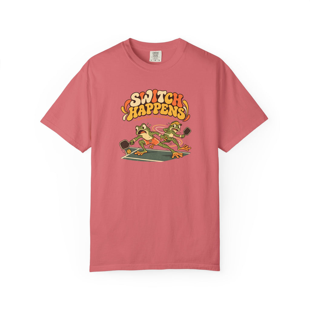 Watermelon colored Switch Happens pickleball t-shirt with colorful retro court graphic and bold curved lettering.