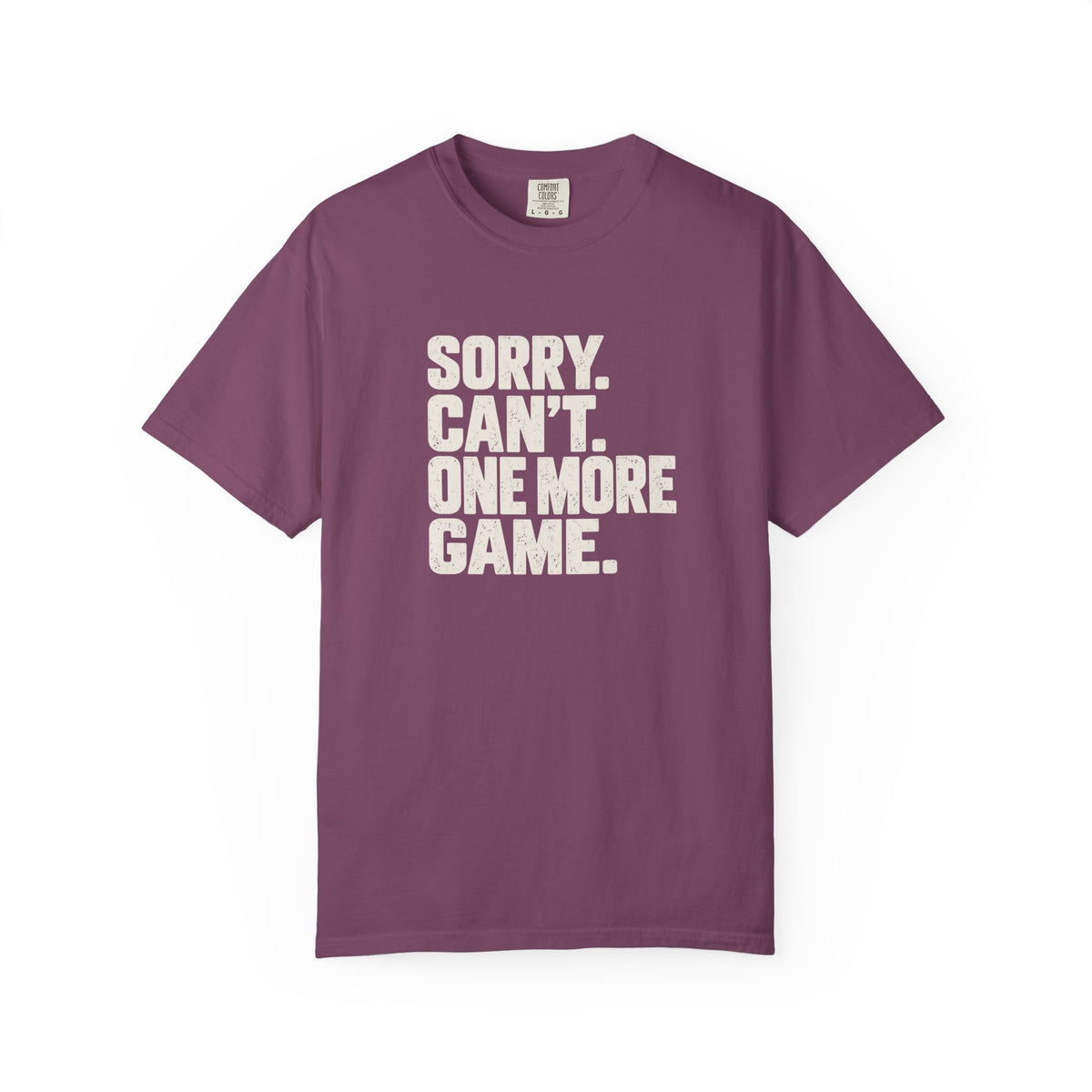 Berry colored Sorry. Can't. One More Game. pickleball t-shirt with bold stacked cream typography.