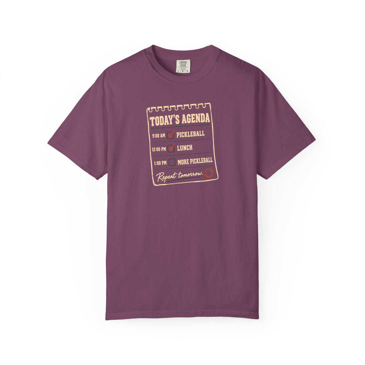 Berry colored Today's Agenda pickleball t-shirt with framed checklist-style pickleball graphic and vintage typography.