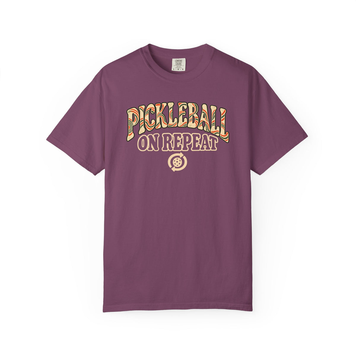Berry colored Pickleball On Repeat pickleball t-shirt with warm retro varsity-style typography.