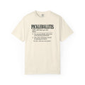 Ivory colored Pickleballitis pickleball t-shirt with dictionary-style diagnosis typography and humorous definition.