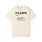 Ivory colored Pickleballitis pickleball t-shirt with dictionary-style diagnosis typography and humorous definition.