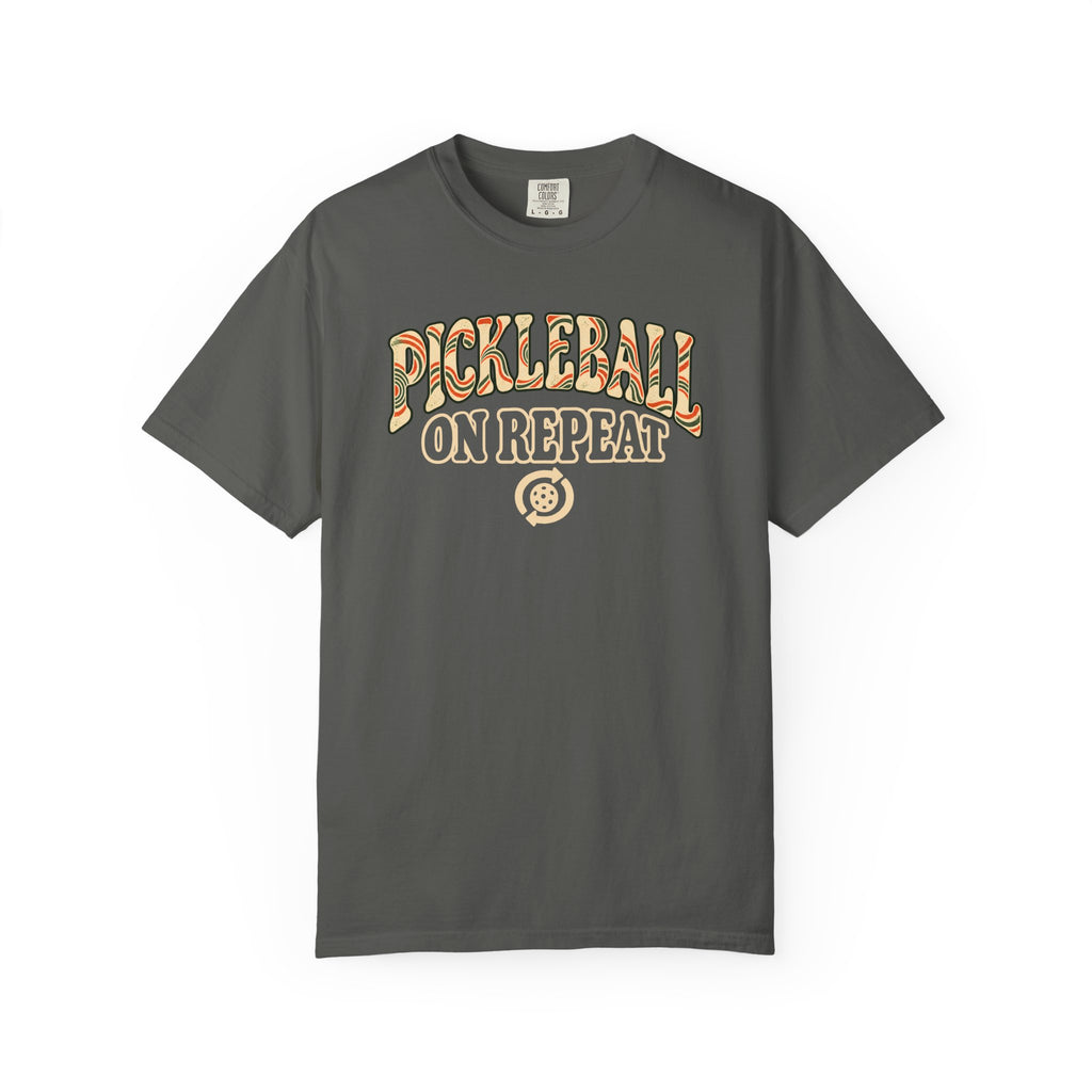 Pepper colored Pickleball On Repeat pickleball t-shirt with warm retro varsity-style typography.