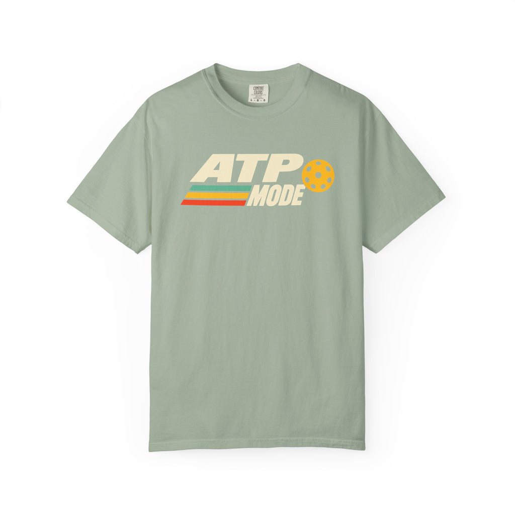 Sage colored Retro ATP pickleball t-shirt with bold ATP lettering, retro speed stripes, and yellow pickleball accent.
