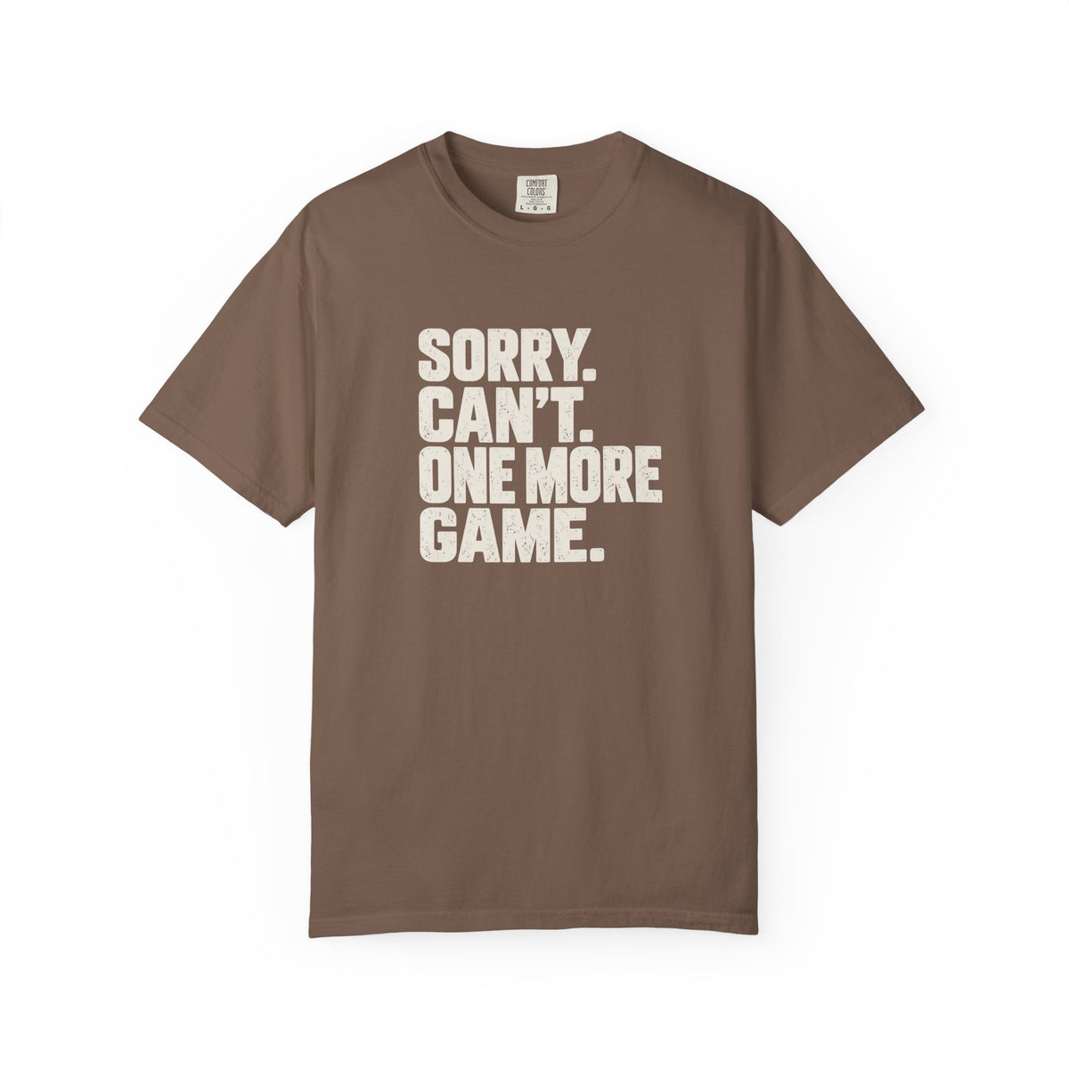 Espresso colored Sorry. Can't. One More Game. pickleball t-shirt with bold stacked cream typography.