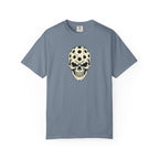 Blue-gray colored Pickleball Skull t-shirt with skull illustration featuring perforated pickleball details.