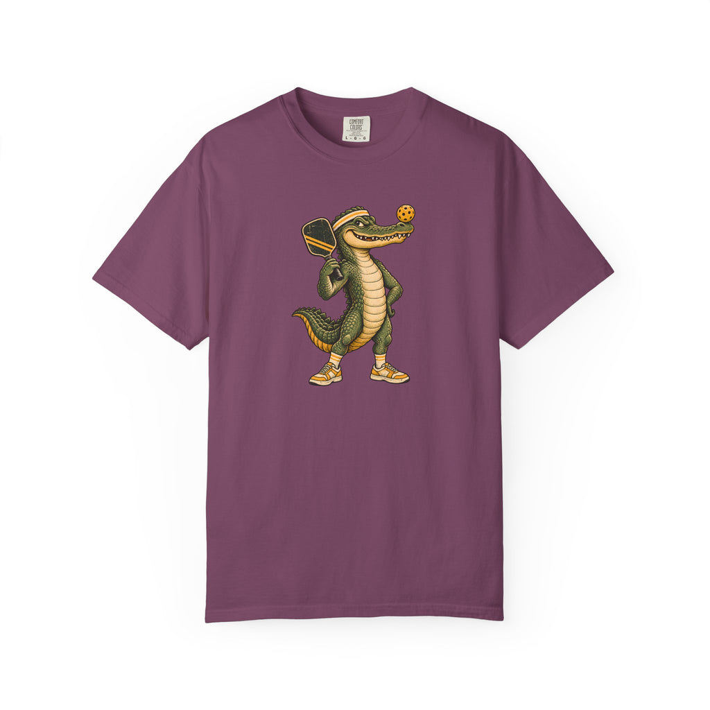 Berry colored Pickleball Gator pickleball t-shirt with cartoon alligator player holding a paddle.