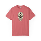 Watermelon colored Pickleball Skull t-shirt with skull illustration featuring perforated pickleball details.