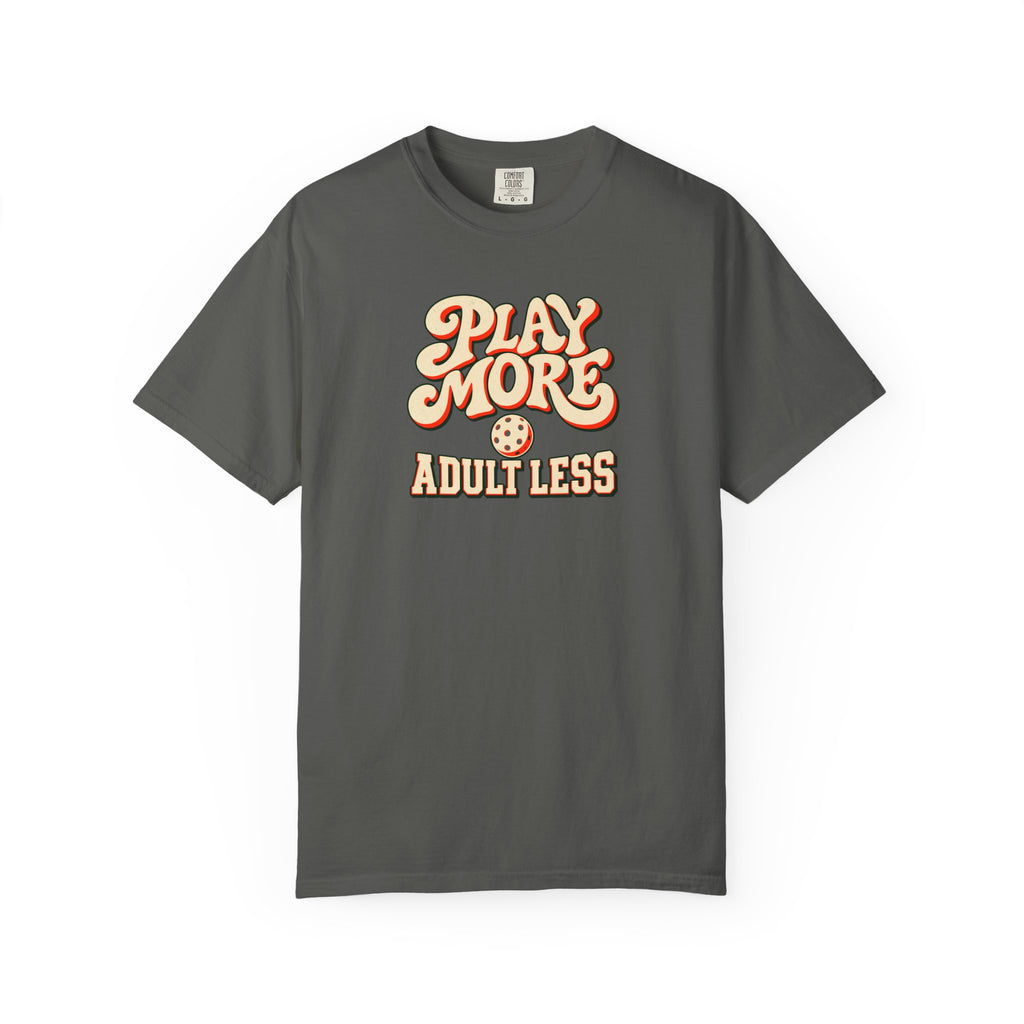 Pepper colored Play More Adult Less pickleball t-shirt with playful cream script typography.