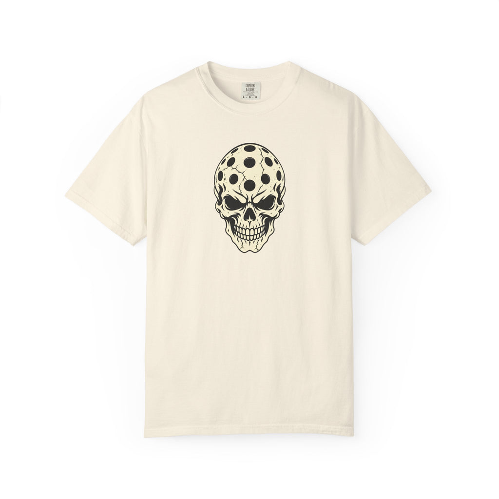Ivory colored Pickleball Skull t-shirt with skull illustration featuring perforated pickleball details.