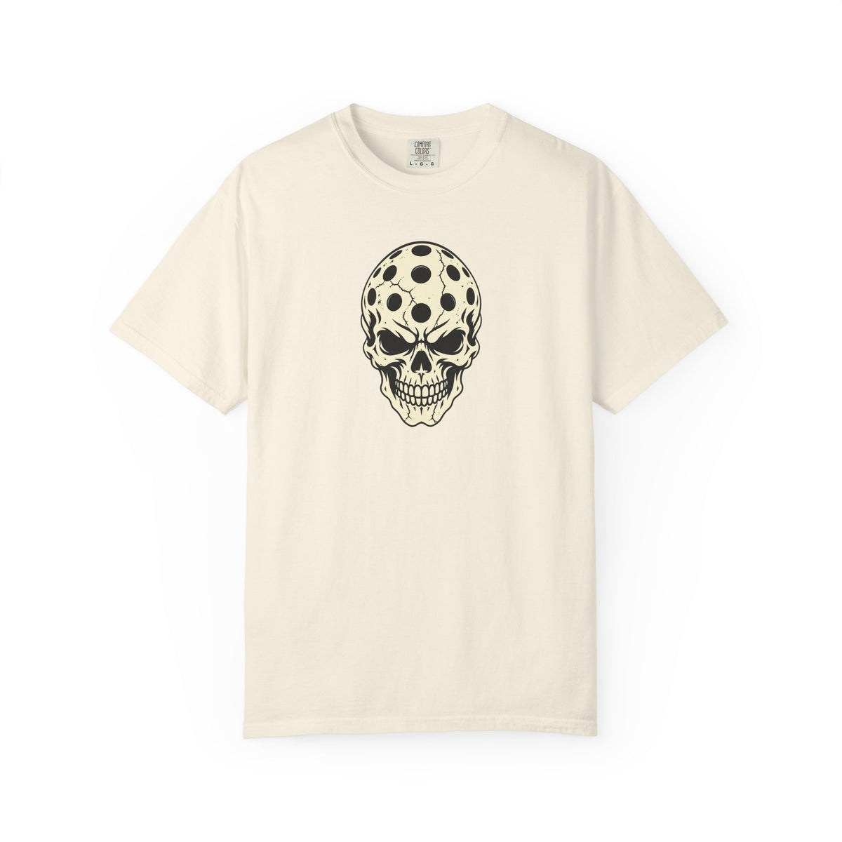 Ivory colored Pickleball Skull t-shirt with skull illustration featuring perforated pickleball details.