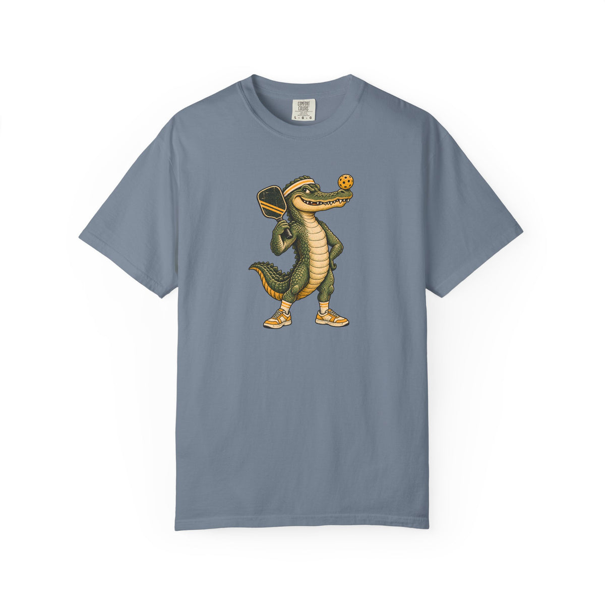Blue-gray colored Pickleball Gator pickleball t-shirt with cartoon alligator player holding a paddle.